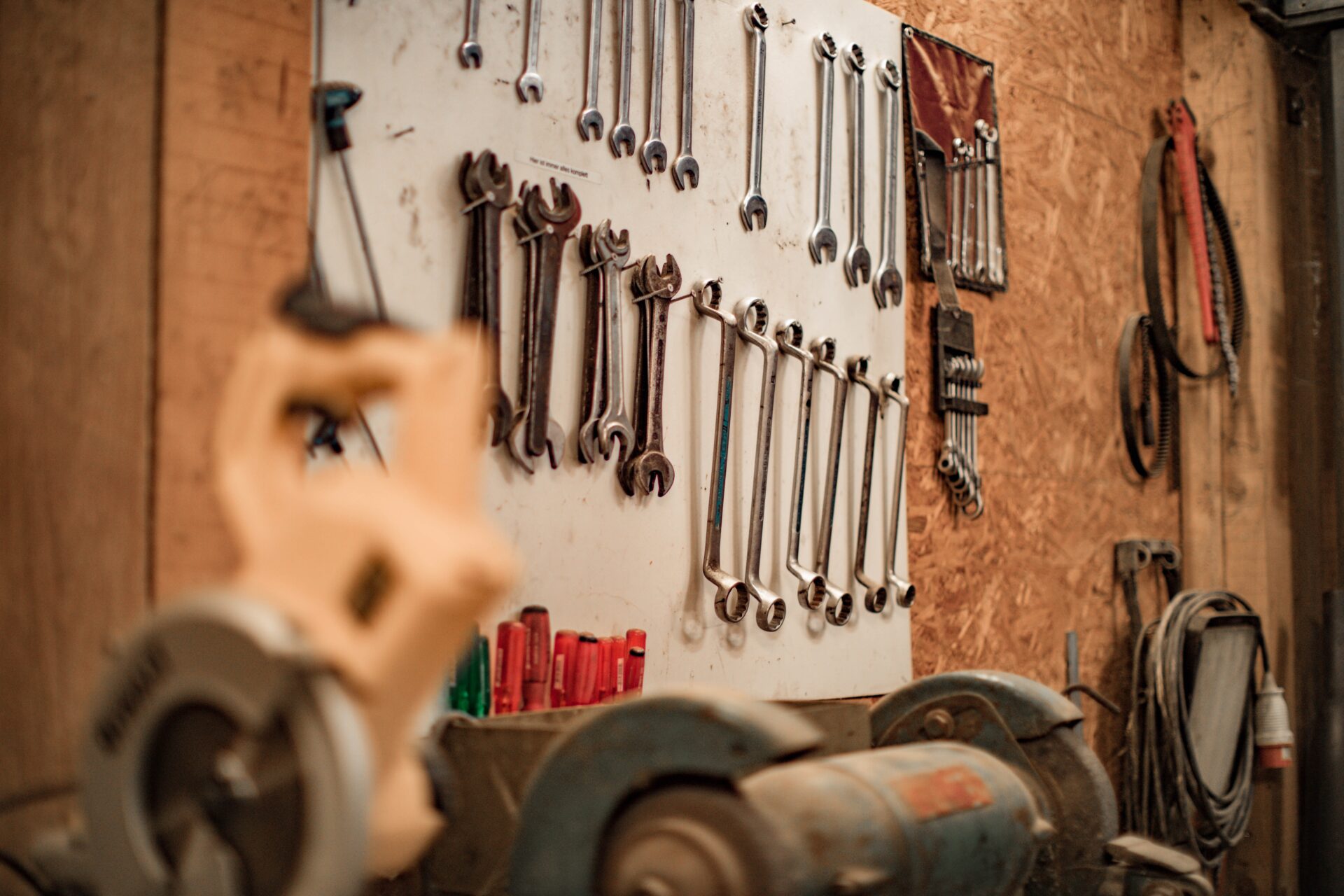 Plumbing equipments on the board Pipes hanging in the basement
